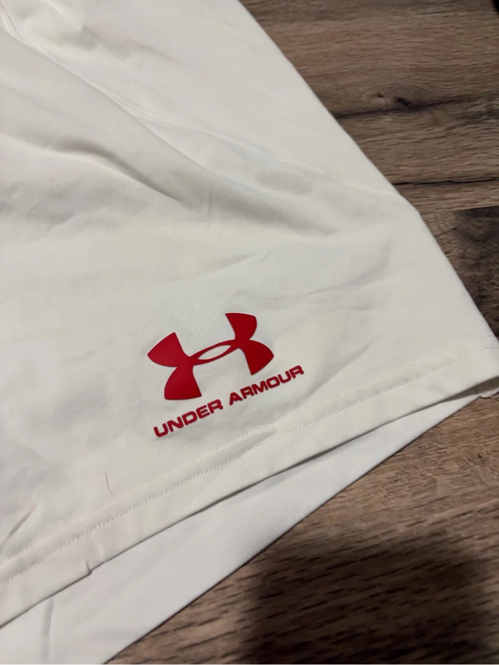 Under Armour White Men’s Athletic soccer Shorts with Red Logo Accents
